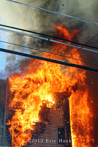 Chicago firefighters battle massive 2-11 alarm fire in apartment building