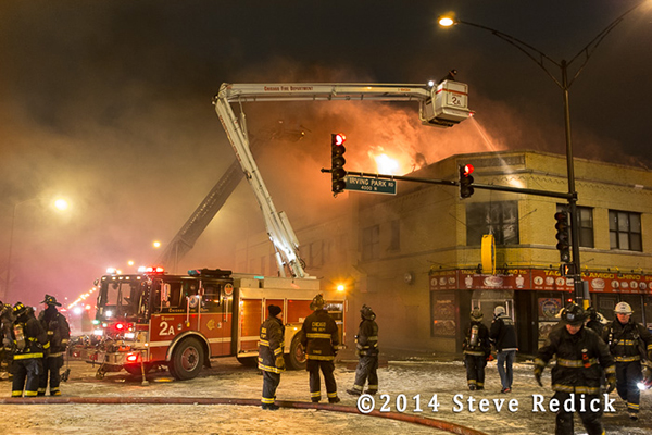 night fire scene in frigid temperatures and blowing snow