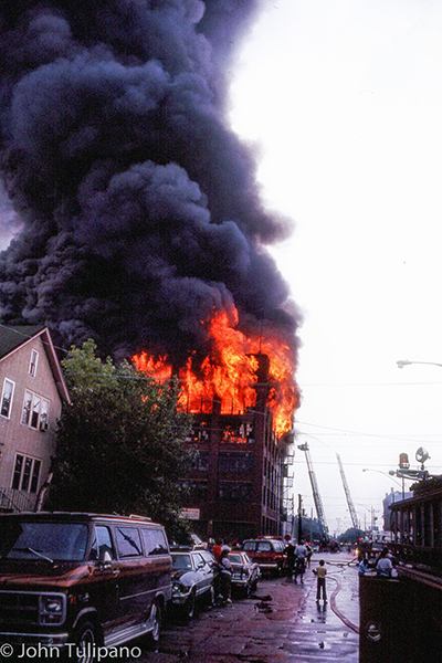 The massive fire seen from a block away. John Tulipano photo
