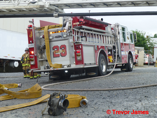 fire engine and hose at fire scene