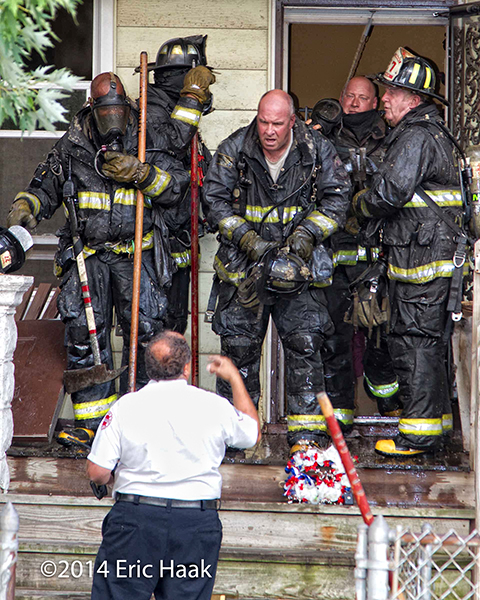 firemen after battling house fire
