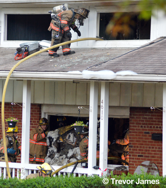 firemen overhaul after house fire