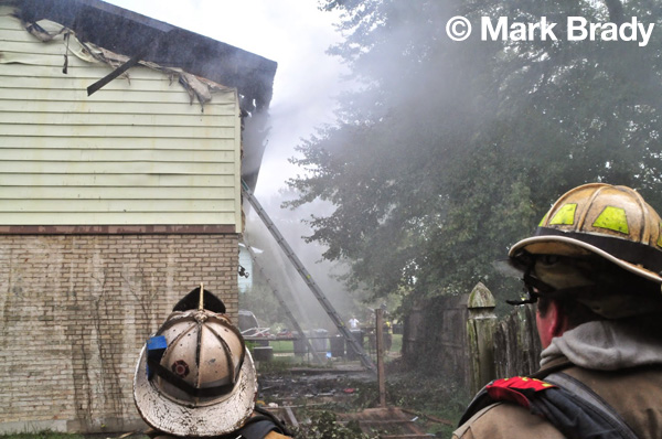 firemen battle a house fire