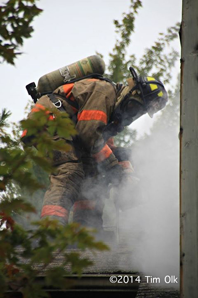 smoke from the roof of a house fire