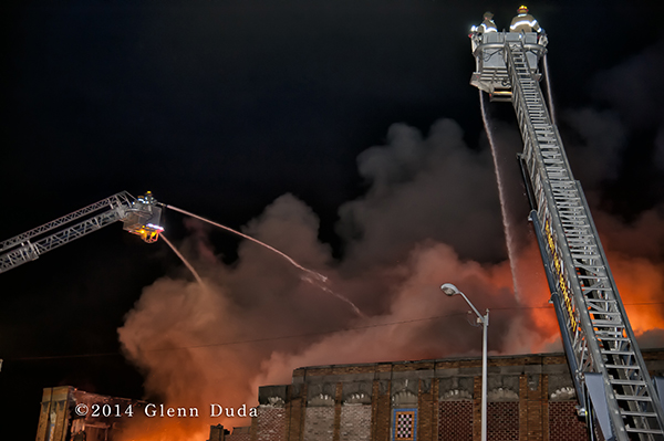 Sutphen tower ladders fighting massive fire