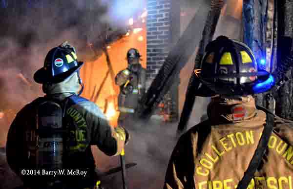 firemen at night fire scene