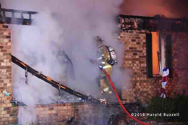 firemen battle rural house fire at night 