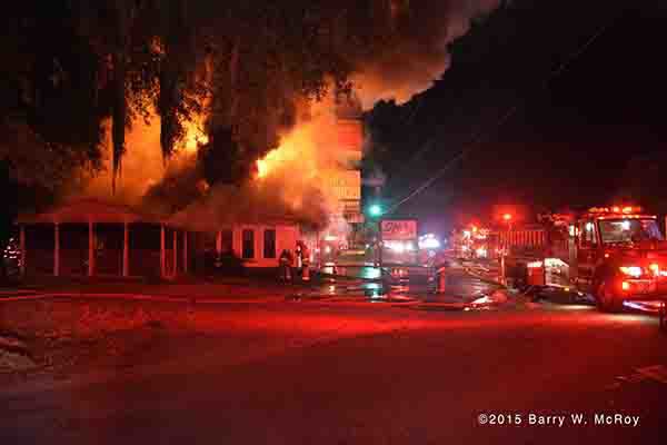 restaurant engulfed in flames at night
