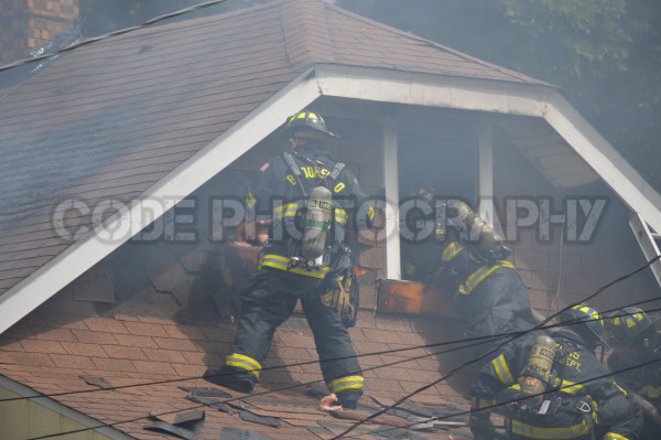 firemen fight house fire