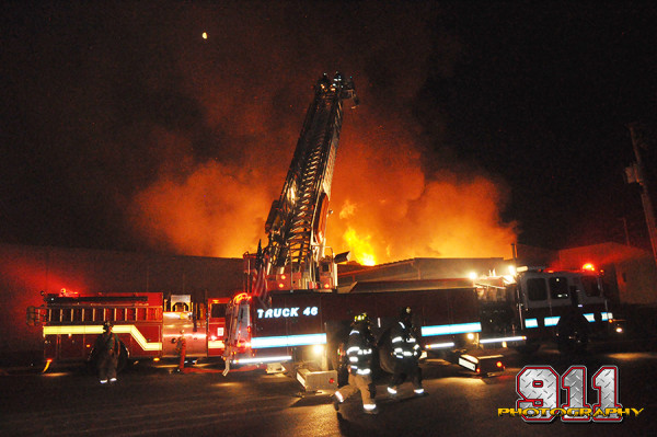 night fire scene at large warehouse