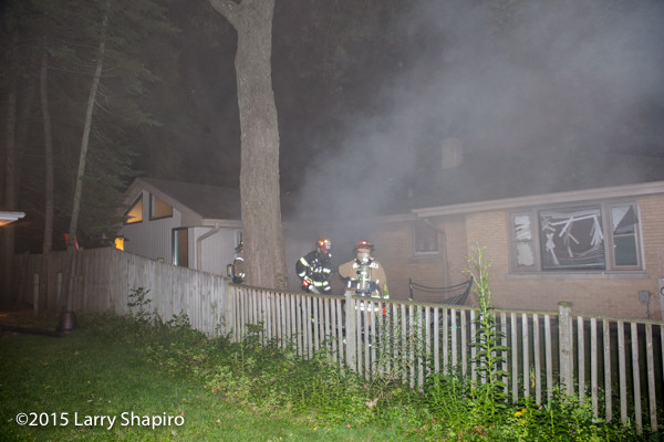 light smoke from house fire at night