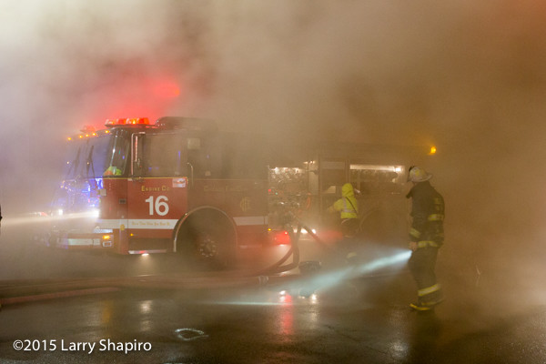 Sopartan fire engine engulfed in smoke at fire scene