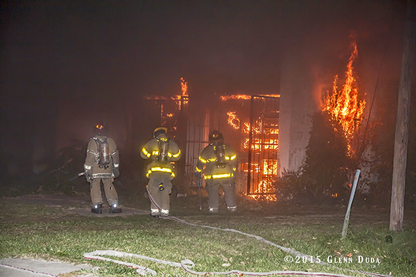 Detroit firefighters working at night