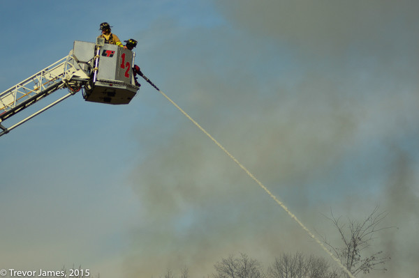 tower ladder working at fire scene
