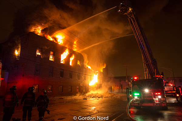 massive building fire at night in CHicago