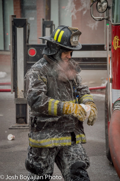 firefighter covered with ice after fire