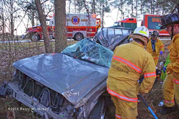 firefighters work to free crash victim