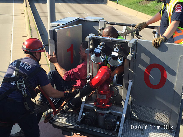 Chicago firefighters save a man threatening to jump onto the highway