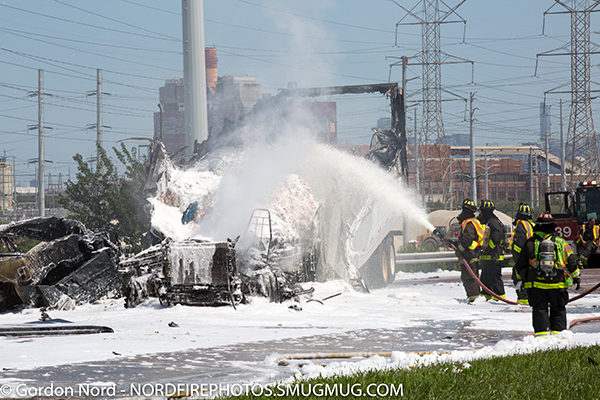 firefighters use foam after truck fire
