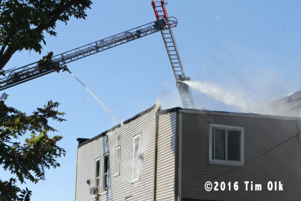 ladder pipes at work during building fire