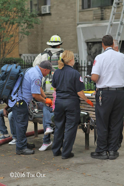 Chicago FD paramedics treat an elderly fire victim