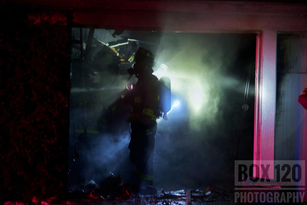 Firefighter silhouette at fire scene