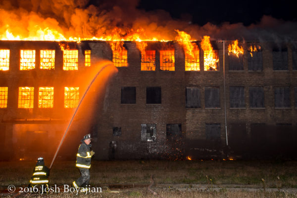 masive warehouse fire at night