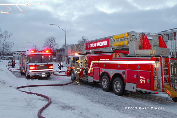 fire trucks at a house fire scene in Elmira Ontario