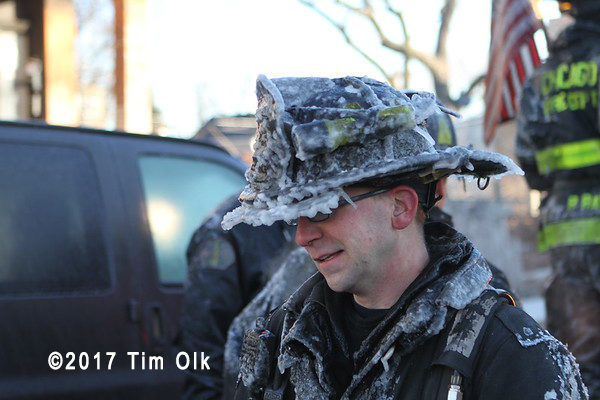 firefighter with ice encrusted helmet