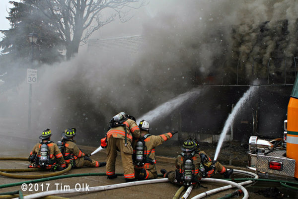firefighters battle smokey fire in store