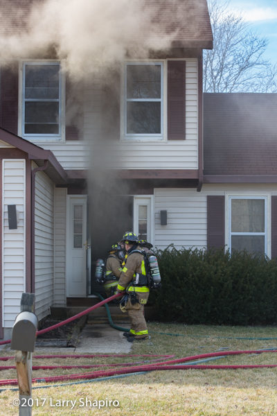 Firefighters enter house on fire