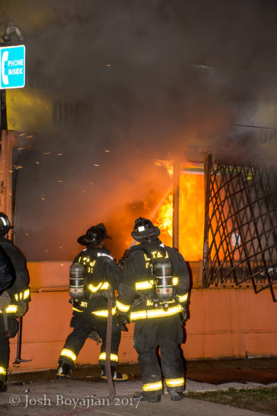 Chicago firefighters battle storefront fire