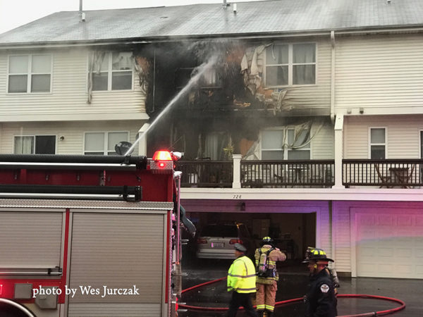 Firefighter battles exterior fire on house