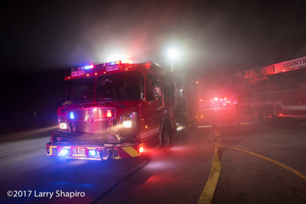 fire engine engulfed in smoke at night