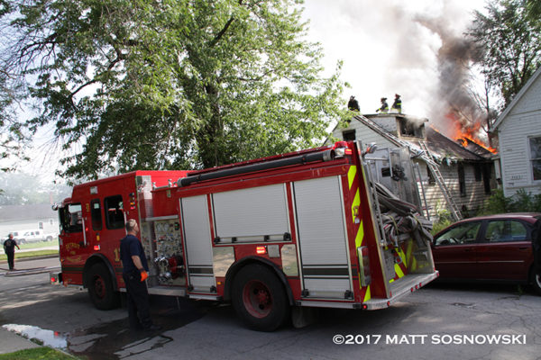 Detroit firefighters battle fire in a dwelling