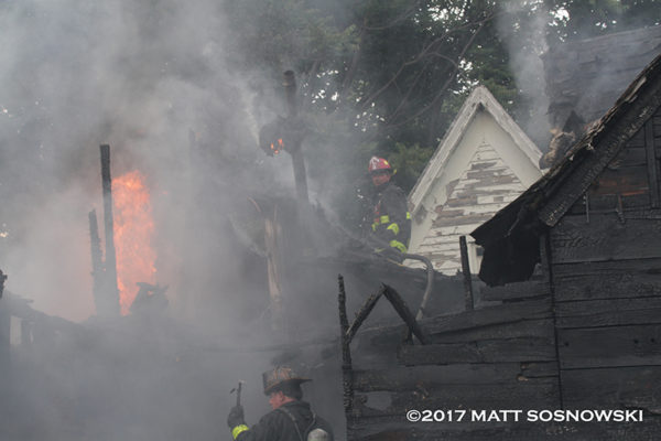 Detroit firefighters battle fire in a dwelling