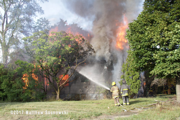 vacant dwelling fully engulfed in flames in Detroit