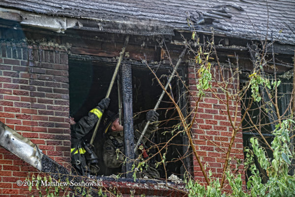 Firefighters overhaul after a fire