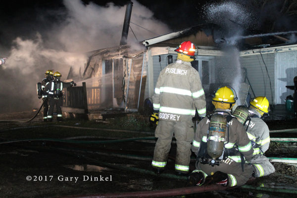 firefighters battle house fire 