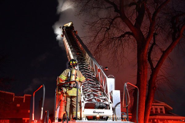 Seagrave aerial ladder at night house fire