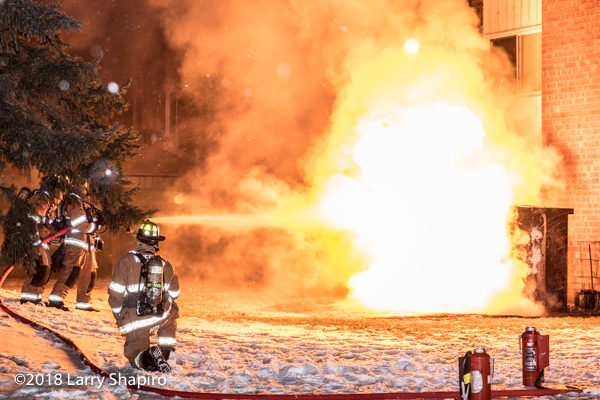 firefighters attempt to extinguish huge flames that engulf electric control box