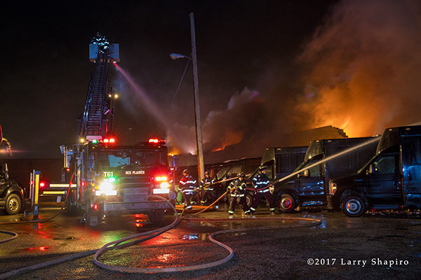 Pierce tower ladder battles large fire