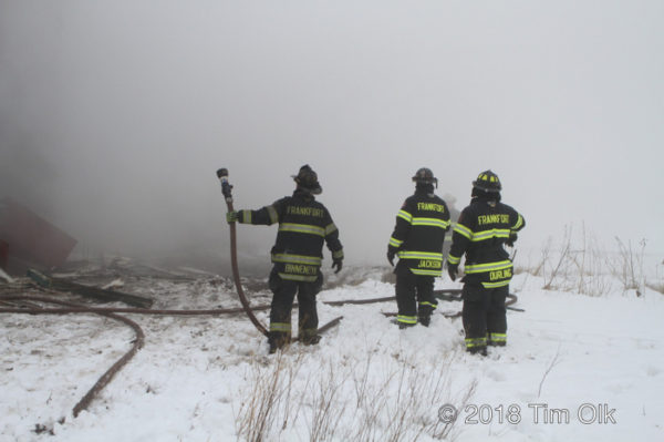 Firefighters at winter fire scene