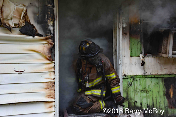Firefighter battles mobile home fire