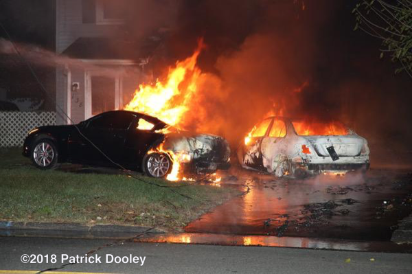 car engulfed in flames spreads to house