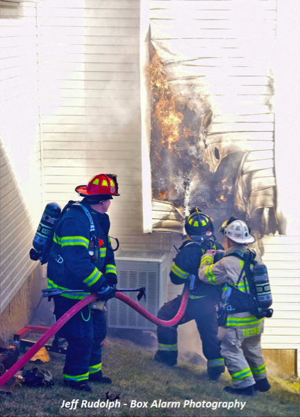 Firefighters battle house fire