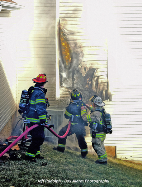 Firefighters battle house fire