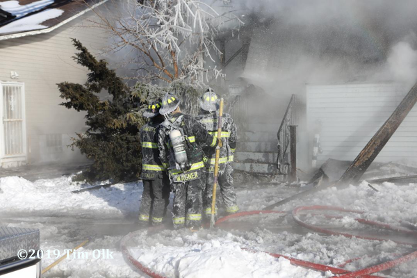 Firefighters encrusted in ice at fire scene