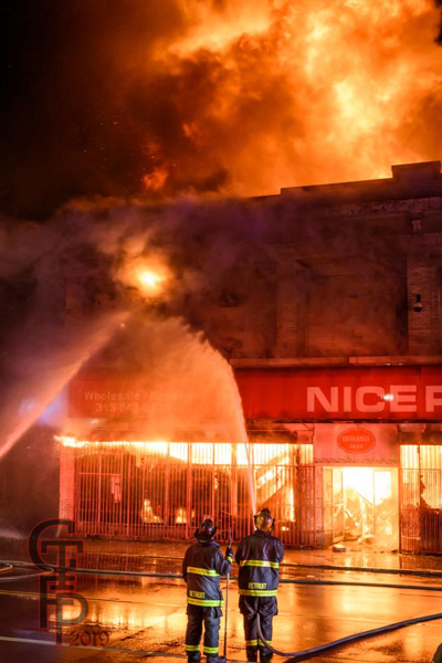 Detroit Firefighters battle a 2-Alarm commercial building fire at night