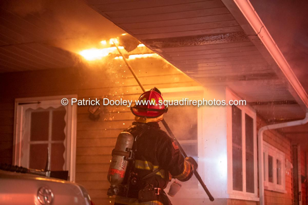 Firefighter pulls soffits on fire